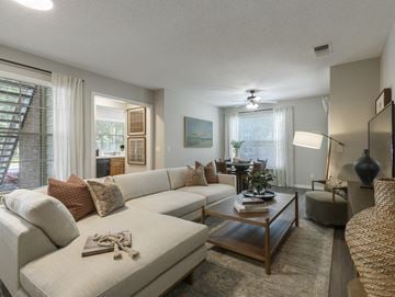 Longwood apartment for rent - A living room with a white couch and a coffee table.