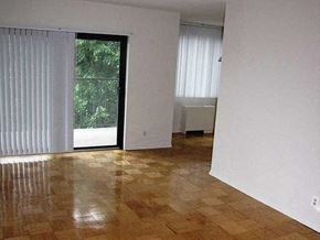Hackensack apartment for rent - an empty living room with a sliding glass door