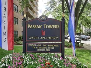 Passaic apartment for rent - a sign for the pasadena towers iii luxury apartments