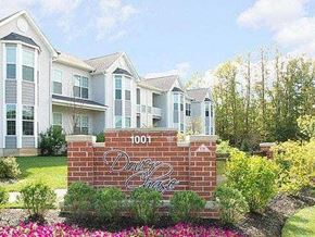 Toms River apartment for rent - a brick sign in front of some houses