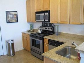 Toms River apartment for rent - a kitchen with a stove microwave and sink