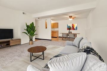Davenport apartment for rent - A living room with a grey couch and a wooden coffee table.