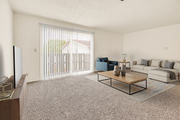 Davenport apartment for rent - A living room with a blue chair and a white couch.