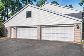 Elkhart apartment for rent - a white garage door in front of a white house