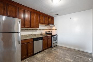 West Roxbury apartment for rent - a kitchen with wooden cabinets and stainless steel appliances