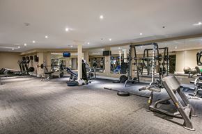 Kingston apartment for rent - a gym with weights and cardio equipment in a building