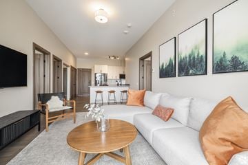 Kingston apartment for rent - A living room with a white couch and a wooden coffee table.