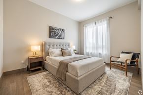 Kingston apartment for rent - Bedroom with Nightstand at 2274 Princess St., Ontario, K7M 3G4