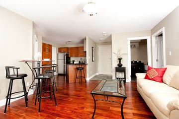 Kingston apartment for rent - a living room with a couch and a table