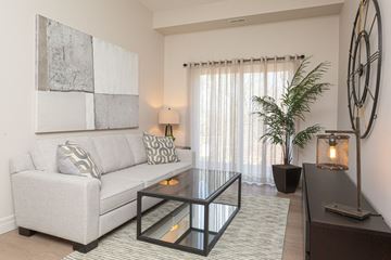 Kingston apartment for rent - a living room with a couch and a glass table