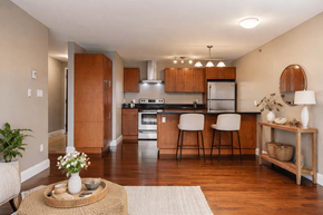 Kingston apartment for rent - A kitchen with wooden cabinets and a white refrigerator.