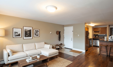 Kingston apartment for rent - A living room with a white couch and a coffee table.