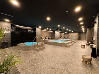 A large indoor spa with hot tubs