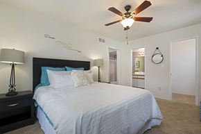 Clinton Township apartment for rent - a bedroom with a bed and a ceiling fan
