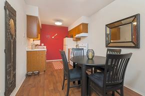 Clinton Township apartment for rent - a dining room with a table and chairs next to a kitchen