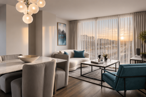 Pointe-Claire apartment for rent - A modern living room with a dining table and chairs.