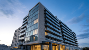 Pointe-Claire apartment for rent - A modern building with a lot of windows and balconies is shown.