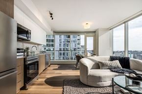 Ottawa apartment for rent - A modern kitchen with a view of the city.