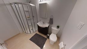 Ottawa apartment for rent - a bathroom with a toilet and a sink and a shower