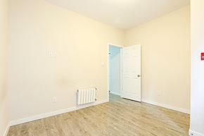 Ottawa apartment for rent - a empty room with a door and a wood floor