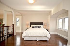 Ottawa apartment for rent - a bedroom with a bed and a staircase
