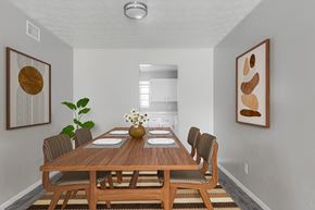 Jacksonville apartment for rent - A dining room with a wooden table and chairs.