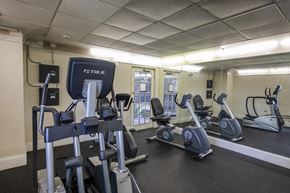 Plantation apartment for rent - A gym with a variety of exercise equipment including treadmills, stationary bikes, and elliptical machines.