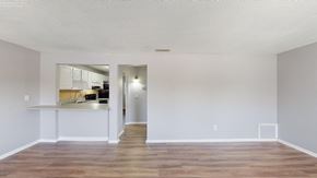 Lakeland apartment for rent - a living room with a kitchen in the background