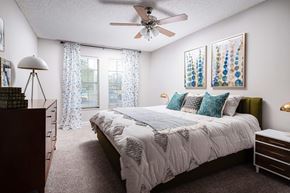 Tampa apartment for rent - a bedroom with a bed and a ceiling fan  at The Park at Chesterfield Apartment Homes, Florida