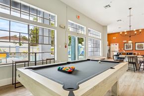 Temple Terrace apartment for rent - A pool table with a green felt cloth and a set of colorful balls on it.