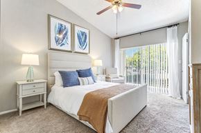 Lauderhill apartment for rent - a bedroom with a bed and a ceiling fan at Waterford Park Apartment Homes, LLC, Lauderhill, FL 33319