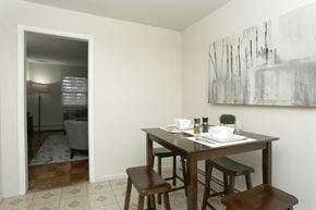New Brunswick apartment for rent - A dining room with a table set for two and a painting on the wall.