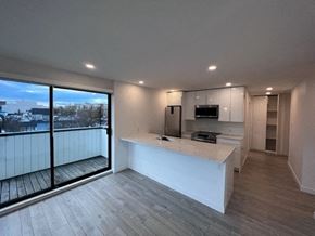 Vancouver apartment for rent - a kitchen and living room with a large window