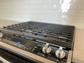 Vancouver apartment for rent - a close up of a stove top oven in a kitchen