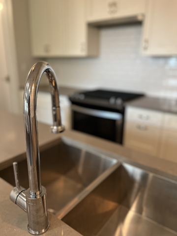 Vancouver apartment for rent - A kitchen sink with a chrome faucet.