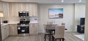 Belleville apartment for rent - A kitchen with a dining table and chairs.