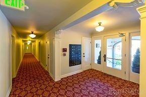 Seattle apartment for rent - a corridor with yellow walls and red carpet