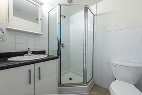Vancouver apartment for rent - a bathroom with a shower and a sink and a toilet