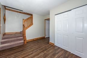 Vancouver apartment for rent - a bedroom with a staircase and a door