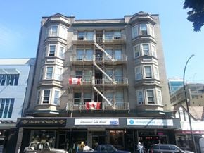 Victoria apartment for rent - a tall building with balconies on a city street