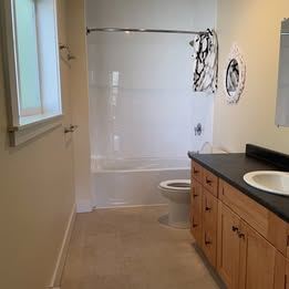 Surrey apartment for rent - A bathroom with a toilet, sink and shower.