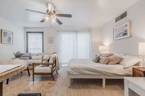 Dallas apartment for rent - a bedroom with two beds and a ceiling fan at Cityscape, Dallas, TX