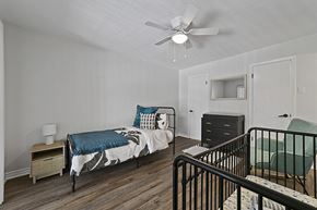 Dallas apartment for rent - Bedroom with cozy bed and light a bedroom with a bed and a ceiling fan at Lakeside Apartments, Dallas, TX