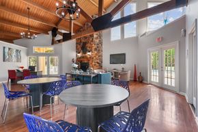 Germantown apartment for rent - the gathering place at gardner village clubhouse with tables and chairs and a fireplace