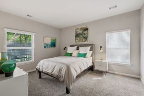 Germantown apartment for rent - a bedroom with a bed and two windows