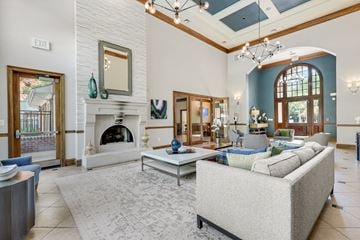 Owings Mills apartment for rent - a living room with a fireplace and a couch and a table