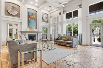 Pikesville apartment for rent - a living room with couches and chairs and a fireplace