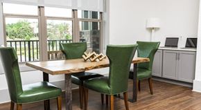 Fairhope apartment for rent - Business center with table and four chairs and laptops at The Retreat at Fairhope Village in Fairhope, AL