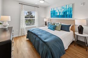 Cocoa apartment for rent - A bedroom with a large bed and a window with curtains. at Allegra at Cocoa in Cocoa, FL, 32926