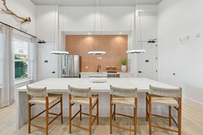 Cocoa apartment for rent - A modern kitchen with a white table and chairs.at Allegra at Cocoa in Cocoa, FL, 32926